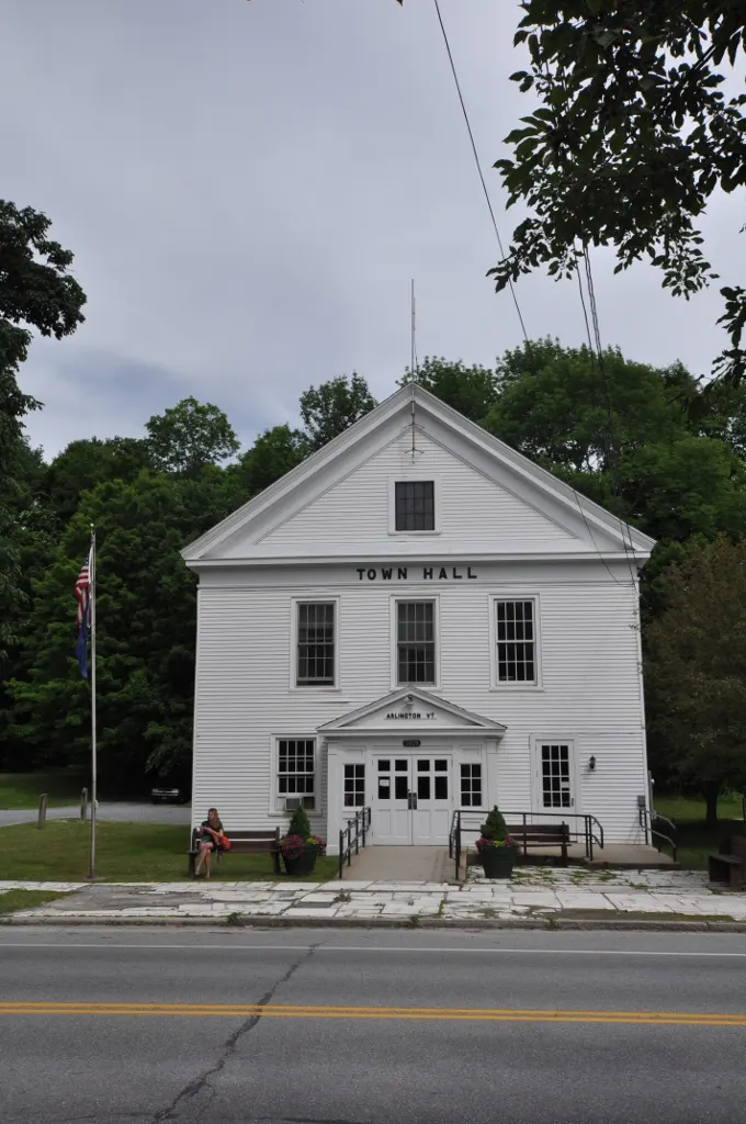 Arlington Town Hall — the white-clapboard civic building with flags
